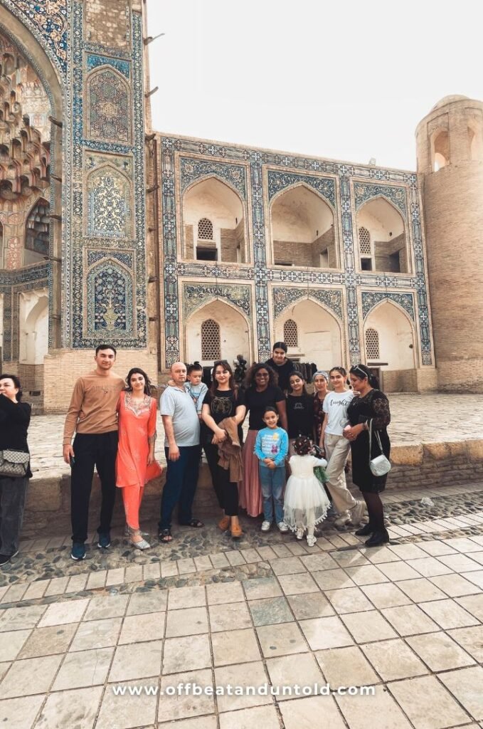 Taking photographs with a local family in Bukhara